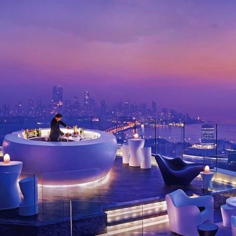 AER Bar and Lounge at the Four Seasons Mumbai. The rooftop bar is a great hangout taking in the Mumbai skyline and watching the sunset over the Arabian Sea. #fourseasonsmumbai #bars #authentictravelexperiences #adventure #bucketlist #culture #getaway #history #holiday #ilovetravel #incredibleindia #india #instago #instatravel #luxury #luxuryasia #luxurytravel #loveindia #northindia #tourism #travel #travelgram #travelindia #travelphotography #travlepics #vacation #view #wanderlust #Indianodyssey Shopify Money, Sky Bar, Best Rooftop Bars, City At Night, Chrysler Building, Rooftop Restaurant, Pool Bar, Hotel Bar, Design Hotel