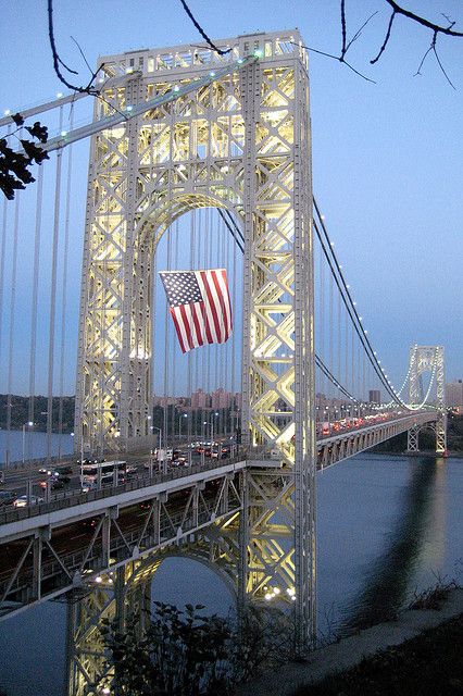 The George Washington Bridge is a 4,760-foot bridge connecting upper Manhattan’s Washington Heights to New Jersey. Completed and opened to traffic in October 1931, the suspension bridge towers 604 feet over the surface of the Hudson River below. It carries more than 106 million vehicles each year, making it the world's busiest motor vehicle bridge. In 1981, the bridge was designated as a National Historic Civil Engineering Landmark. Amazing Bridges, Bridge Structure, Upper Manhattan, Usa City, Washington Heights, Unique Places, I Love Ny, Suspension Bridge, George Washington Bridge