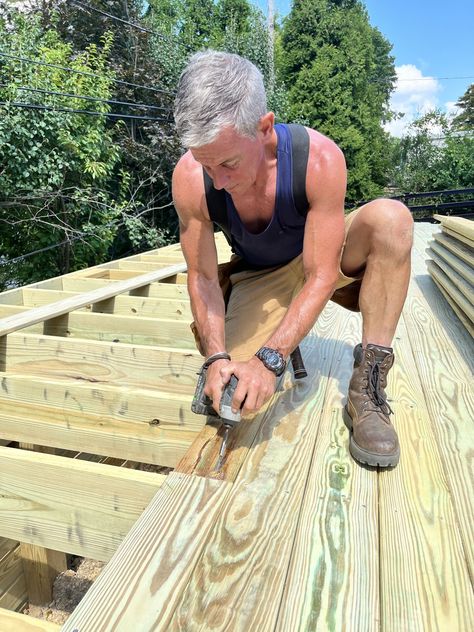 Knowing whether to install decking boards with the rings (crown) up or down isn’t as important as ventilation and decking width when building a backyard... The post How to install deck boards: crown up or down? appeared first on MyFixitUpLife. Red Cedar Deck, Rings Crown, Wood Retaining Wall, Pressure Treated Deck, Decking Boards, Deck Repair, Laying Decking, Cedar Deck, Extreme Makeover