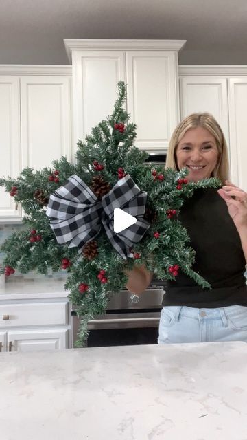 Laura Jeanne on Instagram: "Another Dollar Tree hack using mini Christmas trees 🎄 How pretty and simple is this snowflake wreath?!! 🥰  With the exception of the ribbon, everything was purchased from Dollar Tree.  I’m considering adding lights…🫣😭 I guess it depends on where I decide to hang it.  What do you think? #christmas2023 #christmasiscoming #christmasdiy #christmasdecorations #foryoupagereels #fypシ゚ #dollartreehacks" Dollar Tree Snowflake Wreath, Dollar Tree Christmas Crafts Diy 2023, Dollar Tree Christmas Tree Ideas, Snowflake Wreaths, Christmas Tree Wreath Diy, Christmas Snowflakes Wreath, Mini Christmas Trees, Christmas Bows Diy, Dollar Tree Christmas Decor