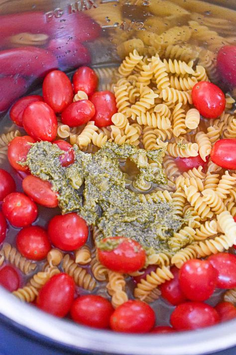 The pesto is added to the Instant Pot. Feta And Tomato Pasta, Feta Tomato Pasta, Pasta Instant Pot, Feta Tomato, Meatless Monday Dinner, Greek Cheese, Wheat Pasta, Feta Pasta, Sauteed Chicken