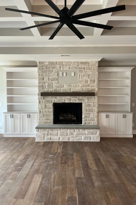 Closed Built Ins Around Fireplace, Vaulted Fireplace With Built Ins, Built Ins With Brick Fireplace, Stone Fireplace With Tv And Built Ins, Stone Fireplace Bookshelves Built In, Cream Stone Fireplace Living Room, Rock Fireplace With Built Ins, Built Ins Around Stone Fireplace, Fireplaces With Bookcases On Each Side