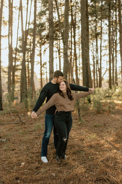 Green And Brown Couple Outfits, Forest Engagement Shoot Outfit, Couple Photoshoot Woods Forests, Woods Couple Pictures, Couple Poses In Woods, Engagement Photos Outfits Forest, Tree Engagement Pictures, Woodsy Couple Photos, Couple Poses In Forest