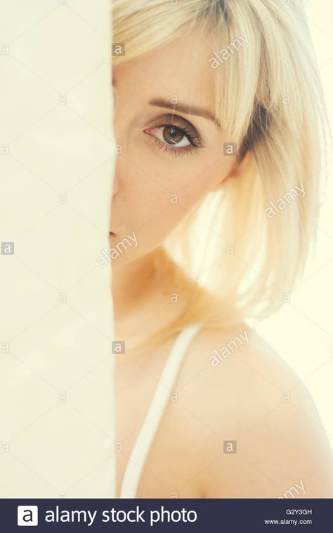 Download this stock image: Young woman hiding behind a wall - G2Y3GH from Alamy's library of millions of high resolution stock photos, illustrations and vectors. Pose References, Young Woman, Pose Reference, High Resolution, Stock Images, Resolution, Stock Photos, Illustrations, Wall