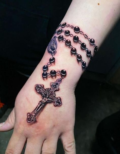 100 Amazing Cross Tattoos To Inspire You - The Trend Scout Rosary Cross Tattoo, Beads Tattoo, Rosery Tattoos On Hand, Rosary Beads Tattoo, Cross With Rosary Tattoo, Rosary Hand Tattoos For Women, Rosary Tattoo For Men, Rosary Tattoo For Women Arm, Cross Hand Tattoo