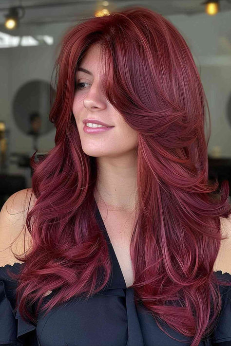 Intense cherry red hair with feathered layers, adding bold volume and flair. Cherry Red Hair With Layers, Deep Vibrant Red Hair, Red Hair With Light Red Highlights, Cherry Red With Blonde Highlights, Intense Red Hair Color, Red Hair With Layers, Layered Red Hair, Cherry Red Hair With Blonde Highlights, Cherry Red Hair Dye