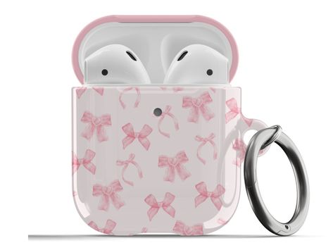 𝗗𝗘𝗦𝗖𝗥𝗜𝗣𝗧𝗜𝗢𝗡: Protect your AirPods with our Pink Coquette Bows AirPods Case! This cute AirPods case features cute light pink bows on a light pink background. ∙ Impact absorbing & scratch resistant case  ∙ Wireless charging compatible ∙ Glossy or matte finish ∙ 3-piece design ∙ Materials: polycarbonate ∙ Slim and lightweight ∙ Precisely aligned port openings ∙ Includes a metal carabiner ∙ Printed in the USA ∙ 360o protection from bumps, drops, and scratches Important note: Our AirPods P Cute Pink Things, Airpods Case Aesthetic, Cute Airpods Case, Cute Airpods, Preppy Phone Case, Girly Christmas Gifts, Bows Coquette, Preppy Gifts, Coquette Bows