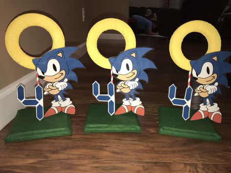 Sonic the Hedgehog table center pieces Sonic Party Centerpieces, Sonic The Hedgehog Diy Decorations, Sonic Table Centerpiece, Diy Sonic Centerpieces, Sonic The Hedgehog Centerpieces, Sonic Centerpieces, Sonic Knights Of The Round Table, Sonic Birthady Table, Sonic Birthday Parties