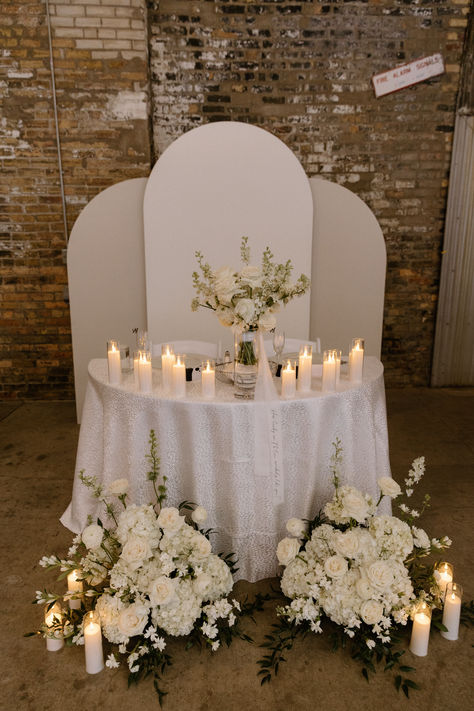 A romantic wedding head table with glowing candles and elegant white floral arrangements, creating a timeless and intimate reception setting. Lantern Sweetheart Table, Simple Head Table Wedding, Head Table Candles, Head Table Design, Dream Wedding Flowers, Top Table Flowers, Sweet Heart Table, Head Table Wedding Decorations, Bride And Groom Table