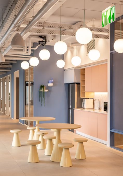 Yotpo Offices - Tel Aviv | Office Snapshots Colorful Workspace, Office Canteen, Staff Room, Office Photo, Cove Lighting, Ecommerce Marketing, Large Dining Table, Office Snapshots, Low Stool