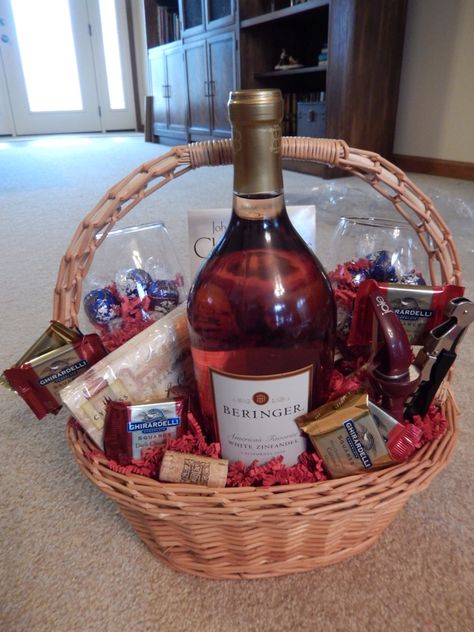 Wine basket I made for an auction. My parents gave me the wine, the basket, the corks I used for decor, and the wine opener...so the cost was only about $15, but we hope it goes for around $40 at the fundraising auction. Liquor Basket Ideas For Women, Wine And Snacks Gift Basket, Wine Bottle And Glasses Gift Basket, Wine Raffle Basket Ideas Fundraising, Wine Basket Raffle Ideas, Wine Baskets Gift Ideas, Wine Raffle Basket, Cheap Wine Basket Gift Ideas, Wine Gift Basket Ideas For Women