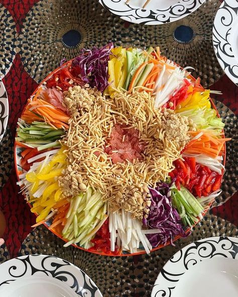 Ruby Raisin on Instagram: "Our annual Prosperity Toss! 🧧🌝🥢 Yee Sang is a traditional salad eaten at Chinese New Year full of crunchy vegetables and fruit, peanuts and crispy noodles all doused in a plum dressing. Usually there’s raw fish but my sister and brother in law make it with Pomelo, the king of all citrus in my opinion and the result is mouth-wateringly refreshing textural heaven. They always arrange it so beautifully and then we mess it up - the higher you toss, the more prosperous y Rainbow Colored Vietnamese Chicken Salad, Yuxiang Eggplant, Rainbow Vietnamese Chicken Salad, Vietnamese Lotus Root Salad, Crispy Noodles, Chinese New Year, Raisin, Plum, Noodles