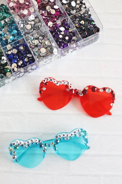 Taylor Swift Inspired Heart Friendship Glasses. Make friendship bracelet inspired heart glasses to wear to the Eras Tour or to celebrate being a Swiftie! Beaded Heart Sunglasses Diy, Taylor Swift Sunglasses Beads, Heart Sunglasses Taylor Swift, Heart Glasses Taylor Swift, Diy Heart Sunglasses, Lover Glasses Taylor Swift, Heart Sunglasses Decorated, Taylor Swift Heart Sunglasses, Taylor Swift Beaded Sunglasses