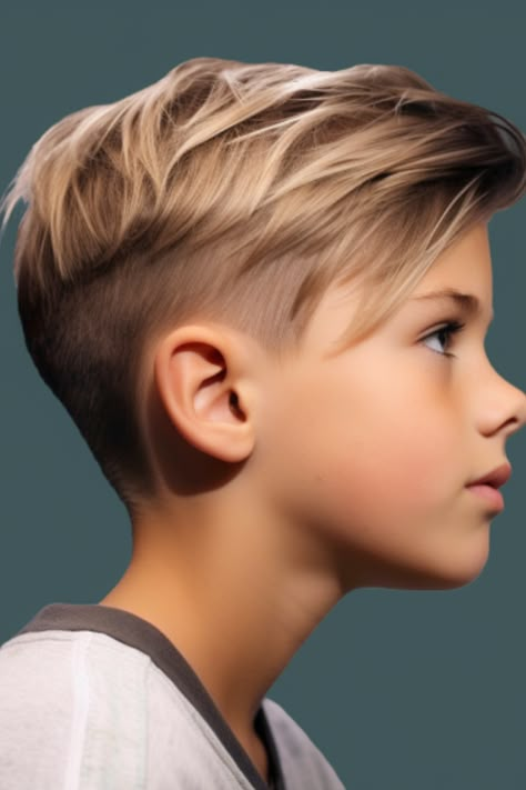 The asymmetrical undercut is a choice for boys who want to make a statement. It involves a skin fade on one side and longer hair on the other creating a visually striking design. Click here to check out more trendiest boys haircuts for school. Cool Kids Hairstyles Boys, Boys Long Hair On Top Short On Sides, Long Hair On Top Short On Sides Boys, Long Top Short Sides Boys Haircut, Boys Hair Long Top Short Sides, Boys Cute Hairstyles, Hear Cut Boys, Boys Hair Cuts 2023 Trends Kids, Trendy Boys Haircuts 2023