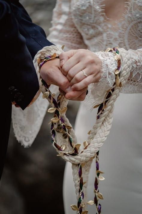 10 Meaningful Traditions From Other Countries to Consider for Your Multicultural Wedding Pagan Wedding Handfasting, Wedding Hand Fasting, Norse Wedding Swords, Viking Wedding Traditions Bridal Crown, Pagan Wedding Theme, Wedding Hand Tying Ceremony, Handfasting Ceremony Photography, Hand Fasting Wedding, Handfasting Wedding Ceremony