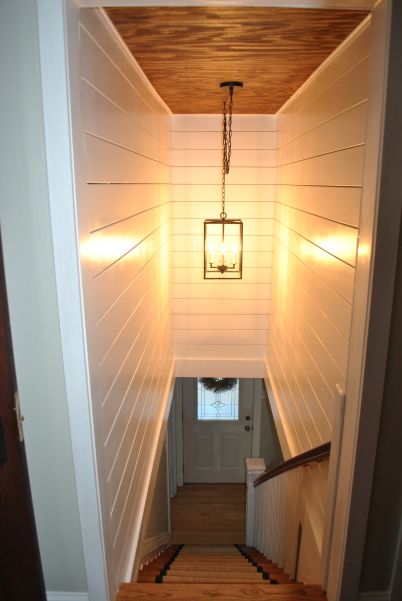 Half Enclosed Staircase, Basement Ceiling Ductwork, Basement Remodel Farmhouse Style, Decorating Stairwell To Basement, Stairwell Makeover Before And After, Home Decor Ideas Basement, Narrow Basement Stairs, Basement Door Ideas Interior Staircase, Paint Stairs Ideas