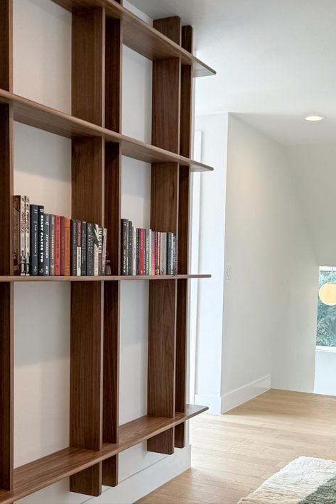 Custom walnut bookshelf built to be floating right above the floor and hide the wall mounting screws Hallway Bookshelf, Walnut Bookshelf, Custom Bookshelves, Floating Bookshelf, Wall Mounted Bookshelves, Bookshelves In Living Room, Shelving Ideas, Bookcase Design, Ultra Modern