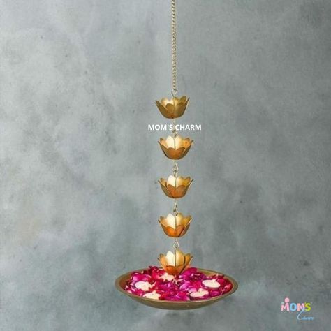 *Lotus Hanging Urli* Decorative lotus flower hanging urli is handcrafted with precision. It can be used as a tealight holder to decorate your home on any occasion such as Diwali, housewarming, get togethers. It's a great wedding gift for newly wed couples. This can be used as a decorative hanging bowl for floating flowers and for tea lights . Order now and decorate your home with this unique and stylish hanging urli. Material - iron Size - 10" diameter of the urli + 5 lotus flowers Note - de Hanging Urli, Lotus Hanging, Flower Hanging, Newly Wed, Floating Flowers, Great Wedding Gifts, Lotus Flowers, Tealight Holder, Tealight