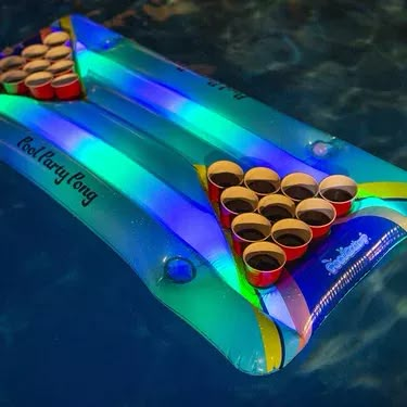 Illuminated LED Pool Party Pong, Multi - PoolCandy Water Play | Maisonette Led Pool Party, Inflatable Pool Party, Glow Pool Party, Glow Pool Parties, Neon Pool Party, Pool Party Activities, Neon Pool Parties, Pool Party Adults, Night Pool Party