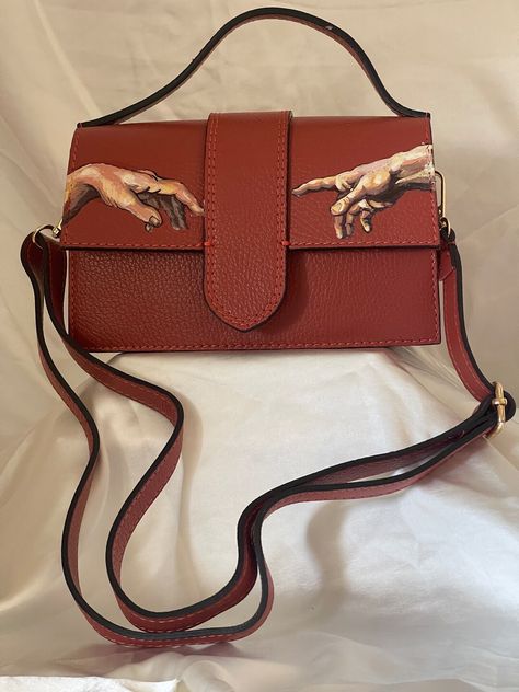 This Sling Bags item is sold by MLynnMDesigns. Ships from United States. Listed on 10 May, 2024 Hand Painted Leather Bag, God Hand, Painted Leather Bag, Hand Painted Purses, Classic Outfits For Women, Painted Purse, Handpainted Bags, Painted Bags, Gods Hand