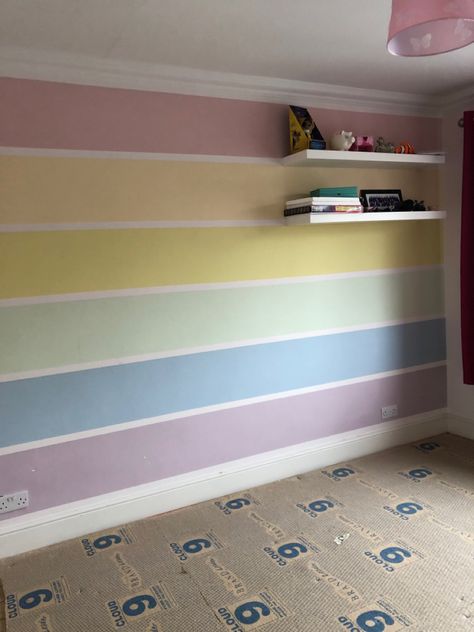 Rainbow bedroom wall Rainbow Bedroom Paint Ideas, Rainbow Paint Ideas For Walls, Rainbow Wall Design, Colourful Playroom Walls, Rainbow Wall Paint Colors, Rainbow Paint Bedroom, Paint Ideas For Girls Bedroom, Pastel Rainbow Bedroom Ideas, Rainbow Feature Wall