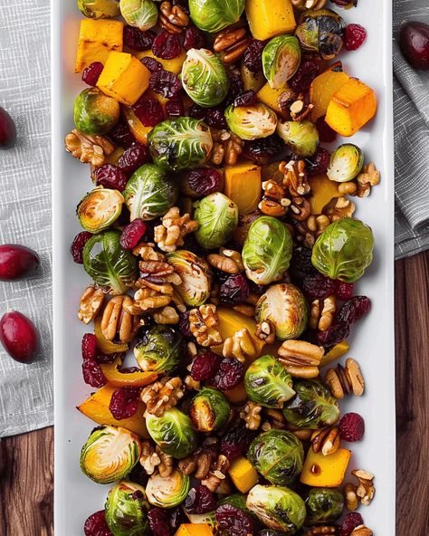 Roasted Fall Vegetables with Cranberries and Maple Walnuts: A Seasonal Side Dish to Savor As the weather cools down and the leaves begin to change, there’s no better way to ... Read more Thanksgiving Vegetable Sides Brussel Sprouts, Roasted Squash With Cranberries, Roasted Veggie Fall Salad, Maple Roasted Veggies, Maple Roasted Root Vegetables, Cranberry Glazed Roasted Vegetables, Roasted Vegetables Brussel Sprouts, Fall Harvest Vegetables, Oven Roasted Fall Vegetables