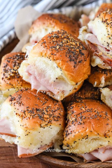 We absolutely love these hot ham and cheese sliders. They are such a great lunch or appetizer! Bake until warm and melty, then serve to a crowd for game day or a party! #hamandcheesesliders #hamandcheese #sandwiches #spendwithpennies Best Darn Ham Sandwiches You'll Ever Have, Hammie Sammies Sandwich Recipes, Ham And Brie Sliders, Holiday Ham Sandwiches, Heavenly Ham Sandwiches, Christmas Ham Sliders, Deli Ham Lunch Ideas, Best Damn Ham Sandwiches, Hot Baked Sandwiches