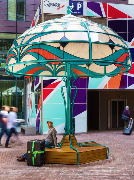 The Manchester Lamps celebrates the city’s rich history of innovation and community.   The artwork is centred around five playfully oversized domestic lamps, each one inviting interaction and engagement with this key public space within the city centre. Each of the 5 installations marks a significant local historical innovation, it’s time period echoed by the lamps distinctive design stye; Art Deco, Art Nouveau, Victorian, mid century and contemporary. Commercial Art Display, Public Space Design Interactive, Interactive Public Art, Urban Art Installation, Public Art Installation, Tips For Artists, Urban Furniture Design, Urban Playground, Public Space Design