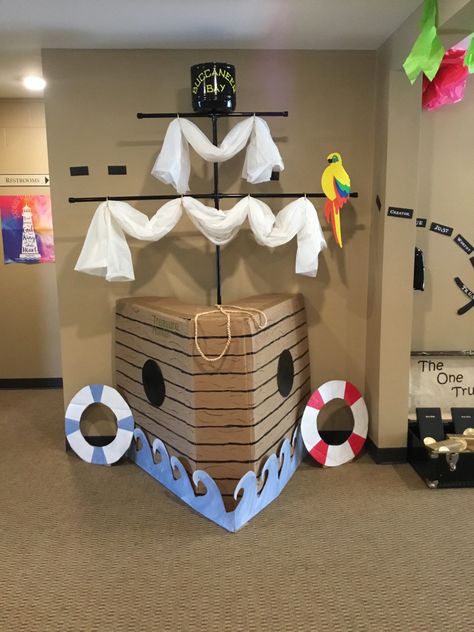 Cardboard Boat Decoration, Pirate Ship From Cardboard Boxes, Pirate Boat Diy Cardboard Boxes, Cardboard Box Pirate Ship, Ship Mast Diy, Pirates Decorations Party, Pirate Boat Diy, Ship Theme Decor, Diy Cruise Ship Prop