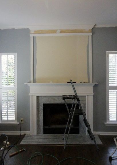 We used molding to extend our standard fireplace to the ceiling. Before, it was simple and standard. We just used a few pieces of molding and wood as well as white trim paint to give it a dramatic look. Before & After We painted everywhere except over the fireplace. We used a nail gun to add molding to form our fireplace shape. We added thick boards at the top to mimic the existing mantle. Here's how it all looked! We caulked all of the seams. We painted the entire a… Painting Trim White, Diy Fireplace Makeover, Fireplace Update, Brick Fireplace Makeover, Shiplap Fireplace, Old Fireplace, Fireplace Remodel, Diy Fireplace, Home Fireplace