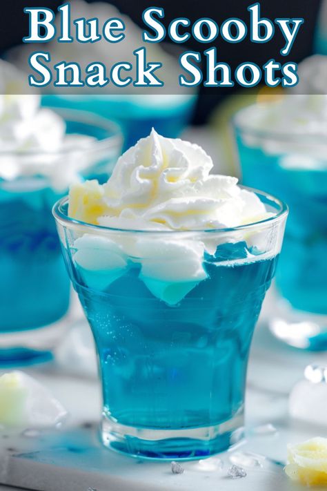 Here’s the Blue Scooby Snack Shot, a fun and vibrant twist on the classic cocktail. These colorful shots combine the tropical flavors of coconut rum, blue curacao, pineapple juice, and banana liqueur for a taste sensation that will transport you to a sunny beach paradise with every sip. Scooby Snack Shot, Lemonade Punch Recipe, Alcoholic Milkshake, Banana Liqueur, Lemonade Punch, Scooby Snacks, Punch Drinks, Shot Recipes, Summer Cocktail Recipes