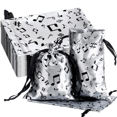 PRICES MAY VARY. Package Contains: you will get 24 pieces of music party favor bags, sufficient quantity to meet your different needs, to prepare exquisite gifts for your music playing friends, members of choir, families, classmates, neighbors, coworkers, colleagues, guests, and so on, they are widely applied as holiday gift bags, anniversary gift bag, retail bag, goodie bags, treat bags, candy bags, toy storage bags and so on Suitable Size: music notes gift bags are about 5 x 7 inches/ 13 x 18 Musical Party Favors, Music Decorations, Music Party Favors, Musical Party, Holiday Gift Bags, Retail Bag, Music Themed Parties, Senior Night Gifts, Bags Storage