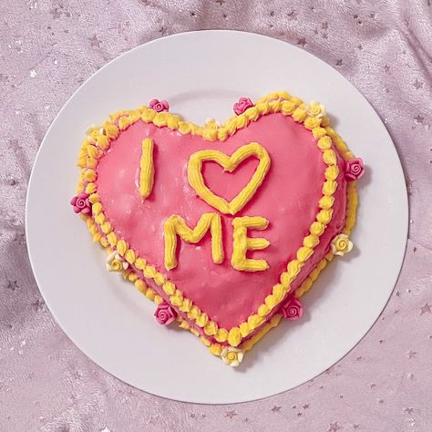 pink heart shaped cake with yellow icing that says i love me Self Love Cake, Heart Cake Inspo Aesthetic, Heart Shaped Zodiac Cake, Heart Shape Chocolate Cake, Maximalist Heart Cake, Heart Cake Aesthetic Galentines, Love Cake, Love Valentines, Chocolate Cake