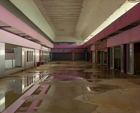 I would guess a dead mall in Florida, picture complementary electric-blue neon accents. Atlas Reference, Mall Nostalgia, Mall Photography, Brain Smoothie, Store Liminal Space, Gas Station Liminal Space, Mall Aesthetic, Abandoned Mall, Liminal Space Gas Station