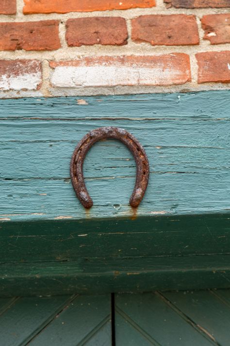 For Best Luck, Hang Your Horseshoe the Right Way | Hunker Horseshoe Good Luck, Horseshoe Over Door, Horseshoe Ideas, Doorway Decor, How To Cut Nails, Horseshoe Decor, Horseshoe Crafts, Hanging Paintings, Lucky Horseshoe