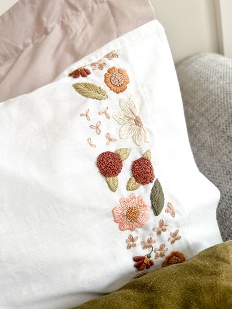 Would you like to embroider pillowcases, tea towels and other home decor, that perfectly matches your vibe? Get your hands on a copy of Creative Embroidery & Beyond, co-authored by Sophie Timms of Mindful Mantra Embroidery with 2 other embroidery artists. Get 18 gorgeous embroidery patterns including this pillow case floral design! Embroidery Pillow Case, Local Bookstore, Embroidery Artists, Book Creative, Hand Painted Wine Bottles, Embroidery Pillow, Embroidery Lessons, Painted Wine Bottles, Hand Embroidery Projects