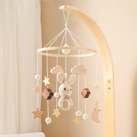 Our Baby Cloud Crib Animal Musical Mobile, a delightful addition to your baby's nursery. With soothing melodies and adorable animal friends, it captivates and calms your little one, creating a serene and playful atmosphere. Wooden Baby Mobile, Crib Mobiles, Rabbit Rattle, Wooden Cribs, Newborn Bed, Wooden Mobile, Car Seat Toys, Pram Toys, Crib Toys