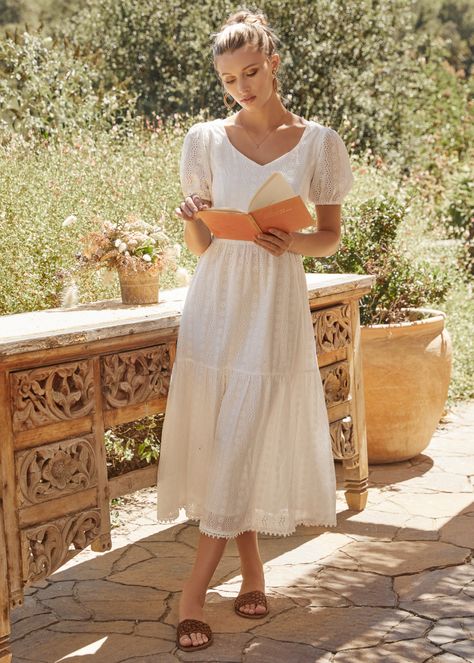 Our Middle of Nowhere Midi Dress is perfect for any adventure you plan this spring! With it's clean white floral pattern, this style features a smocked back bodice for stretch and comfort, with flirty, puffed sleeves and a delicate lace trim throughout the hemline. Invisible back zipper with clasp closure. Fully Lined Imported 100% Cotton Model is 5 ft 9 inches; Bust: 32", Waist: 23.5", Hips: 35" and wearing a size Small Runs true to size Hand wash or wash with gentle cycle with cold water with Romantic Dress Pattern, Smocked Midi Dress, Cute Pink Midi Dress, White Cotton Midi Dress, White Midi Dress Outfit, Mass Outfit, Sunday Dress Outfit, College Summer Outfit, Modest White Dress