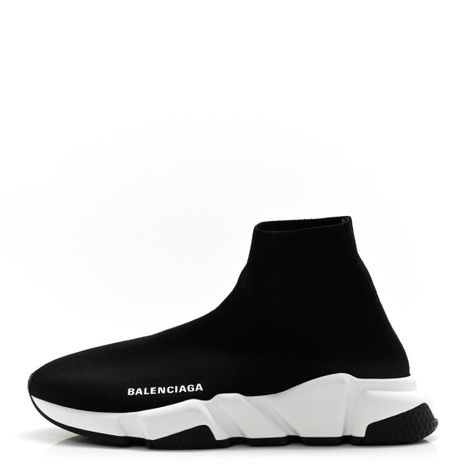 This is an authentic pair of BALENCIAGA Neoprene Knit Womens Speed Trainer Sneakers size 38 in Black. These sneakers are made of knit material in black. They feature a white Balenciaga logo on the sides, rib-knit heel, memory sole with an embossed logo at heel. White Balenciaga, Balenciaga Logo, Trainer Sneakers, Knitting Materials, Embossed Logo, Rib Knit, Balenciaga, Black White, Black And White