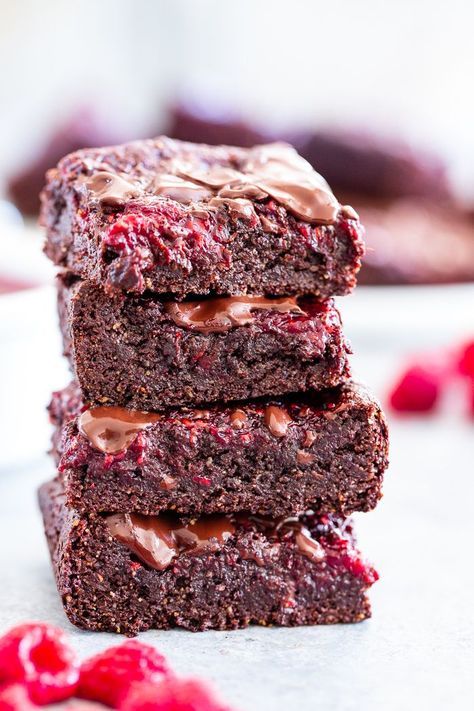 These insanely fudgy raspberry brownies are easy to whip up and just happen to be good for you!  Rich chocolate paleo and vegan brownie batter is baked with an easy raspberry sauce for the ultimate fruit and chocolate combo.  They’re gluten-free, dairy-free, and completely addicting! Brownie Chocolate Chip Cookie, Chocolate Chip Cookie Dough Cake, Raspberry Brownie, Chocolate Raspberry Brownies, Paleo Running Momma, Chocolate Chips Cookies, Cookie Dough Cake, Raspberry Brownies, Double Chocolate Chip Cookies