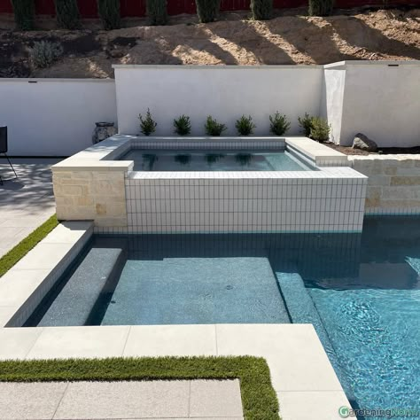 Pool Waterline Tile Ideas 2023, Raised Spa Tile Ideas, Hot Tub Tile Ideas, Raised Spa With Pool, Pool Tile Waterline Modern, White Pool Tile Waterline, Modern Pool Tile Ideas, Pool Waterline Tile Ideas, Pool Coping And Tile