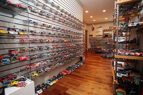 Basement turned into a safe haven for model cars! - Decoist Diecast Display, Contemporary Basement, Black Store, Contemporary Family Room, Hot Wheels Display, Model Cars Collection, Modern Basement, Foam Tiles, Cars Design