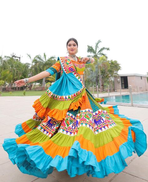 Isn’t this look like a sea of fabric flowing in the air gracefully? Have you noticed beautiful details on blouse sleeves?! SHAKTI - Navratri collection 2024 The colourful bliss to the wearer and the viewer both! Traditional ikkat prints along with the gamthi borders and the frills at the bottom are the eye candies! The most comfortable light weighted and classic outfit to go for this navratri! HMUA : @prieti_salon Jewellery : @auraartjewels #ethnicwear #garbafashion #navratrifa... Festive Navratri Fabric With Dupatta, Latest Navratri Collection 2024, Traditional Multicolor Fabric For Navratri, Navratri Traditional Wear With Nida Fabric, Navratri Chaniya Choli Latest 2024, Navratri Blouse Designs, Navratri Traditional Multicolor Embroidered Fabric, Navratri Long Sleeve Embroidered Fabric, Dandiya Dress