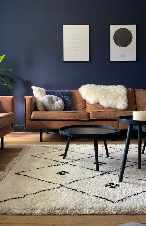 Blue Tan And Black Living Room, Blue Walls Grey Floor, Dark Wood And Blue Living Room, Blue Wall Brown Couch, Navy And Wood Living Room, Navy And Terracotta Living Rooms, Navy Walls Living Room, Blue Brown Interior, Brown Leather Couch Living Room