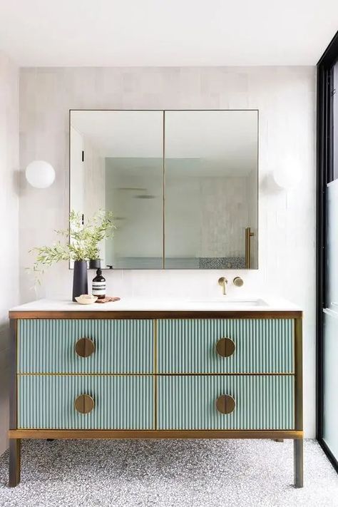 a beautiful bathroom nook with a mint green fluted vanity with brass knobs and framing, a double mirror and some greenery Bathroom Nook, Fluted Vanity, Restroom Remodel, Laundry Chute, Luxe Bathroom, Engineered Timber Flooring, Green Vanity, Recycled Brick, Double Mirror