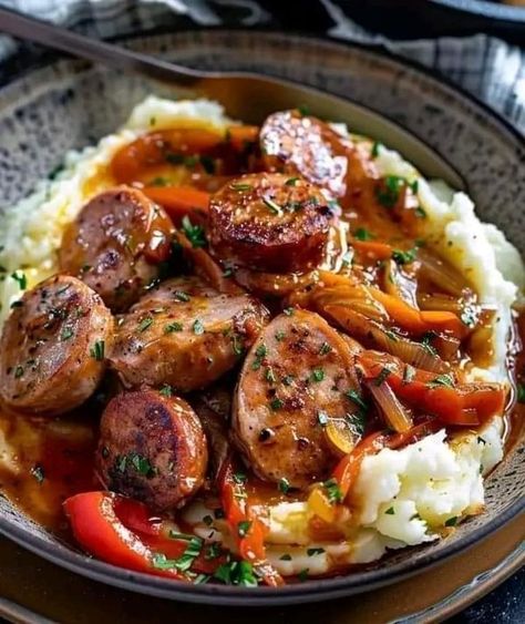 Giada De Laurentiis 🍕🍜 | Rustic Italian Sausage with Peppers and Onions over Garlic Mashed Potatoes | Facebook Sausage With Peppers And Onions, Garlic Mashed Potatoes Easy, Twice Baked Potatoes Casserole, Easy Mashed Potatoes, Italian Sausage Recipes, Easy Peasy Recipes, Baked Potato Casserole, Cheesy Mashed Potatoes, Rustic Italian