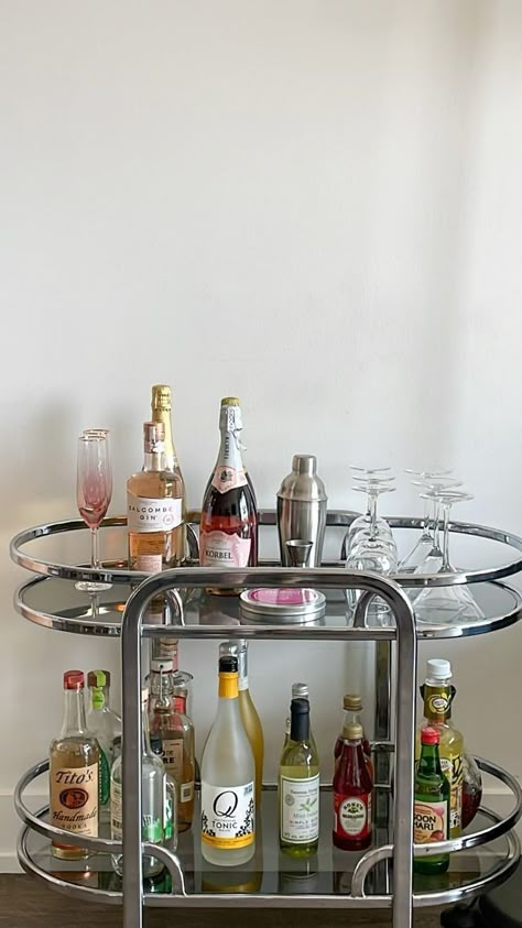 Drink Cart Aesthetic, Living Room Bar Ideas Apartments, House Bar Aesthetic, Aesthetic Bar Stools, Bar Cart In Living Room Ideas, Vintage Bar Cart Aesthetic, Aesthetic Home Bar, Silver Apartment Decor, Cocktail Cart Ideas