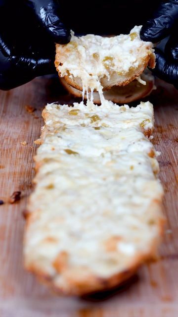 Jordan Isom on Instagram: "Make this Monterey Jack Bread on Game Day and thank me later!🔥🔥Recipe⬇️⬇️

Ingredients:

1 loaf french bread (sliced lengthwise)
1 stick butter
1 small can diced green chilis
1tsp garlic powder
1tsp inion powder
2 pinches salt
1/2 cup mayo
8oz or more shredded monterey jack cheese

Directions:

Add one stick softened butter, green chilis, and seasonings to a bowl and mix. 

Next add the mayo and shredded cheese to a bowl and mix. 

Add a layer of the butter mixture to the bread followed by a layer of the cheese mixture on top. 

Bake or smoke at 400F degrees for about 20 min. Enjoy!

#gameday #appetizer #bread #easyrecipe #cheesy #partyfood" Appetizer Bread, Green Chilis, Holiday Cheese, Canned Green Chilies, Stick Butter, Colby Jack, Colby Jack Cheese, Monterey Jack, Monterey Jack Cheese