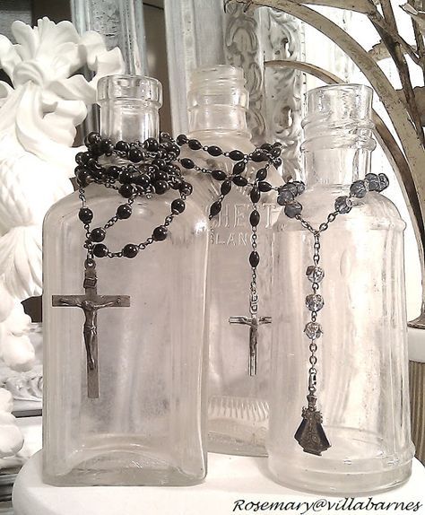 -display rosaries on antique bottles...love this idea. If not Catholic, you could browse your jewelry box for most any string of beads. Vibeke Design, Catholic Decor, Catholic Home, Altered Bottles, Home Altar, Jewelry Displays, Antique Bottles, Vintage Bottles, Old Bottles