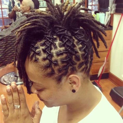 Super creative and neatly done. #NaturalHair Microlocs Mohawk, Loc Hawk Styles, Dreadlock Mohawk Women, Loc Mohawk Styles Dreadlocks, Mohawk Dreadlocks Women, Locs Mohawk Styles Women, Mohawk Loc Styles Black Women, Mohawk Locs For Women, Dredlocs Style Woman